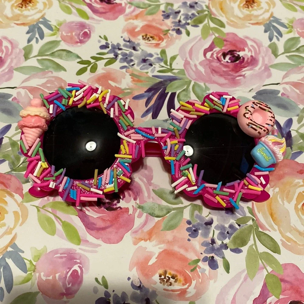 Girls hot pink flower shaped sprinkle sunglasses